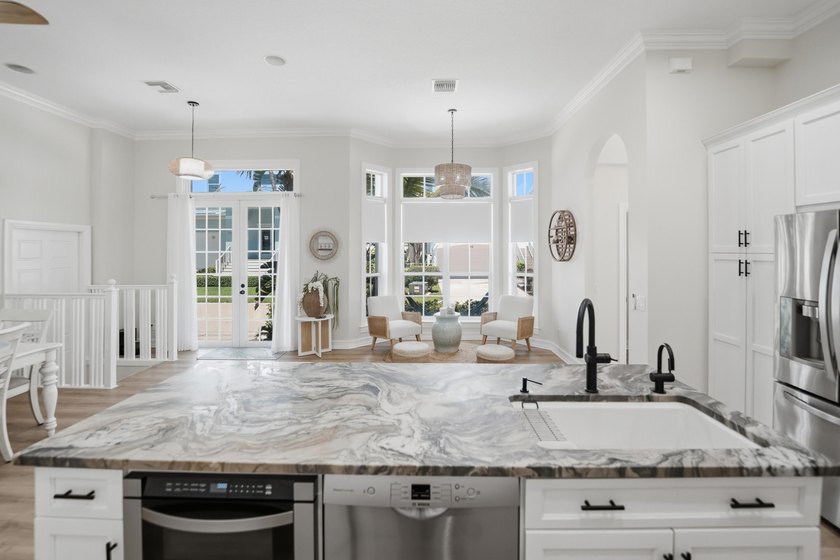 Located in the gated Jupiter Key community just steps from the - photo 13