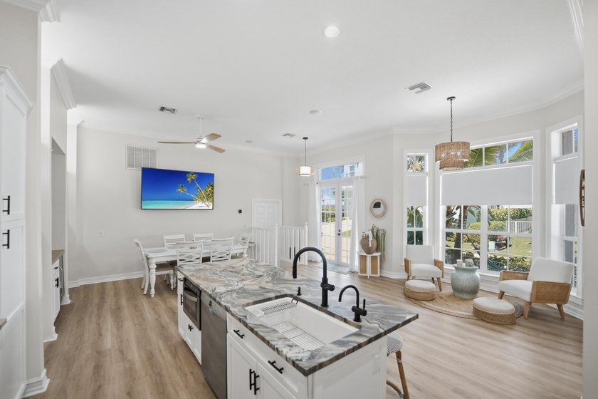 Located in the gated Jupiter Key community just steps from the - photo 14