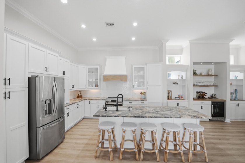 Located in the gated Jupiter Key community just steps from the - photo 15