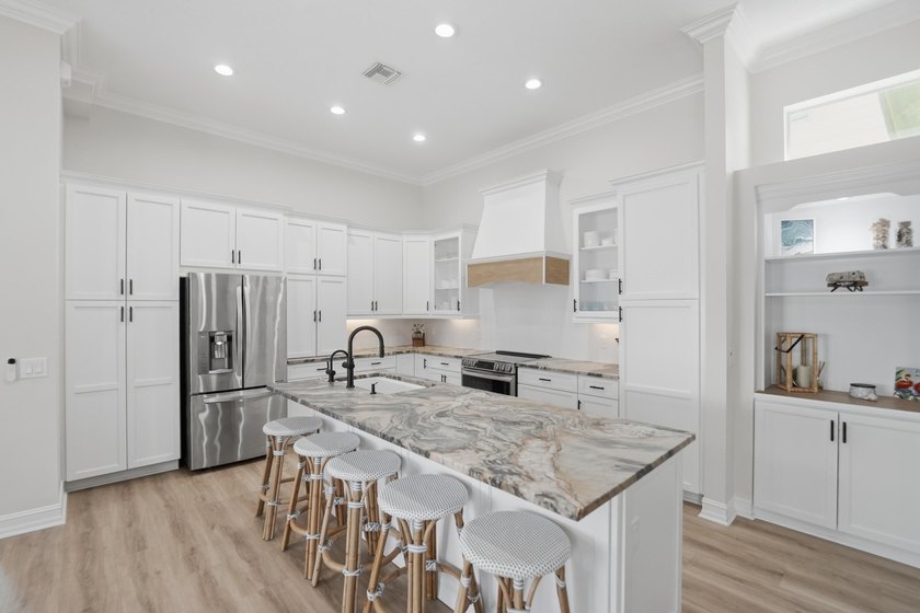 Located in the gated Jupiter Key community just steps from the - photo 16