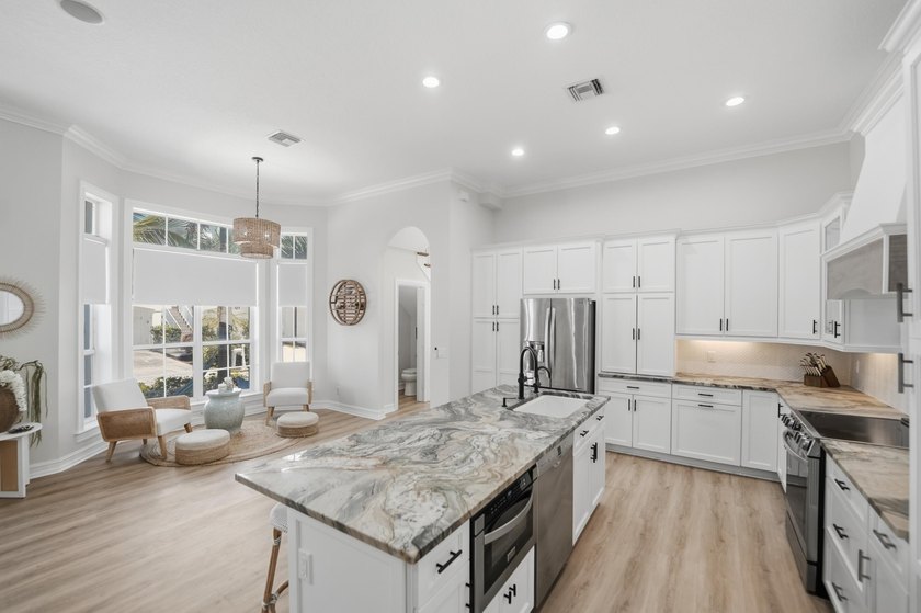Located in the gated Jupiter Key community just steps from the - photo 19