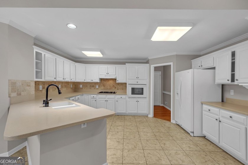 Welcome home to this beautifully maintained 3-sided brick ranch - photo 14