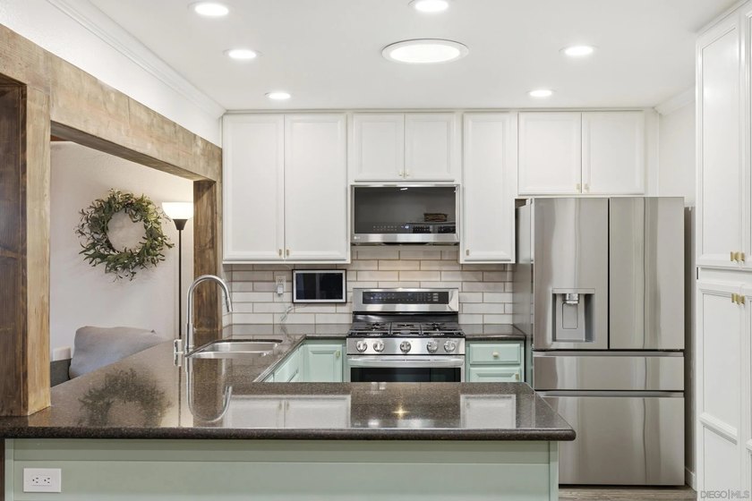 Welcome to this beautifully renovated 4-bedroom, 2-bath home - photo 8
