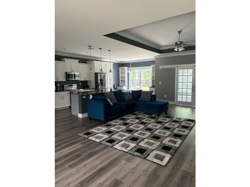 Beautiful open floorplan house with view of pond in backyard - photo 9