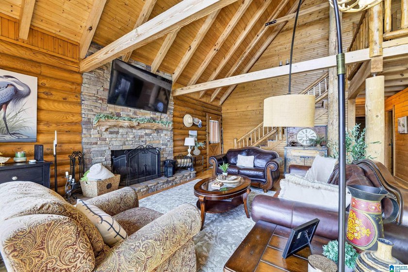 Experience refined lakefront living in this exceptional log - photo 12