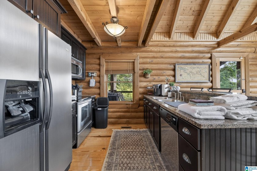 Experience refined lakefront living in this exceptional log - photo 15