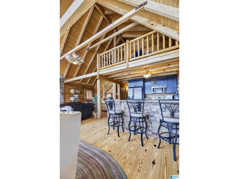 Experience refined lakefront living in this exceptional log - photo 16