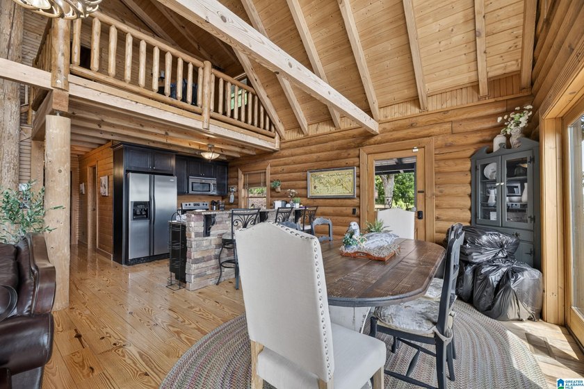 Experience refined lakefront living in this exceptional log - photo 18