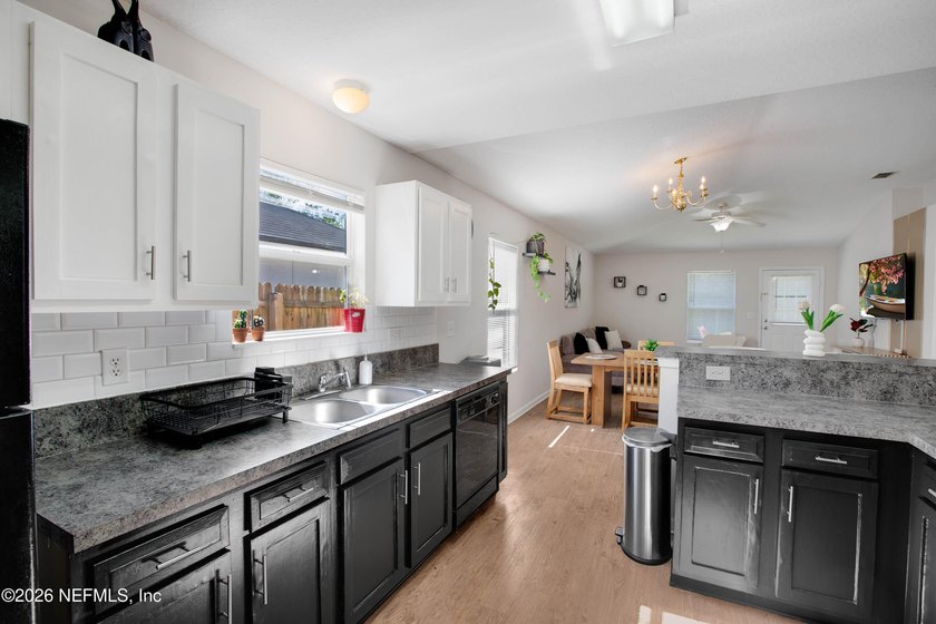 Welcome to this charming 4-bedroom, 2-bathroom home offering - photo 21