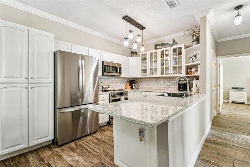 COMPLETELY REMODELED, great location and PRICED TO SELL! Own - photo 2