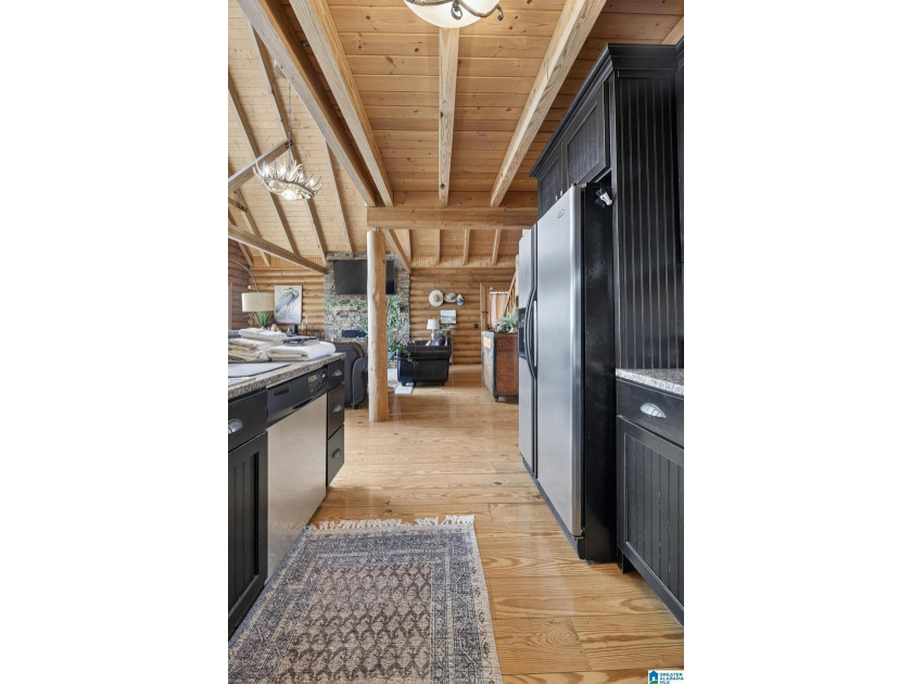 Experience refined lakefront living in this exceptional log - photo 36