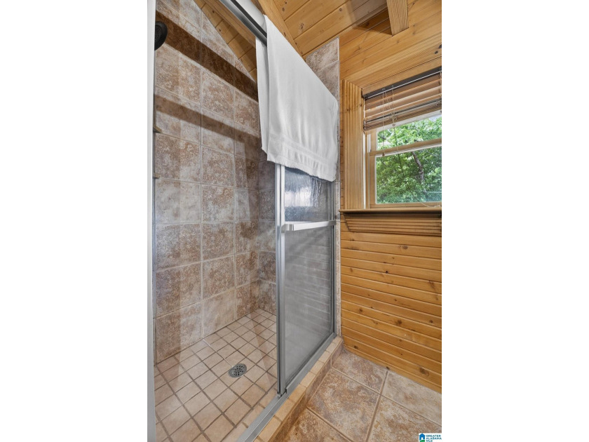 Experience refined lakefront living in this exceptional log - photo 40