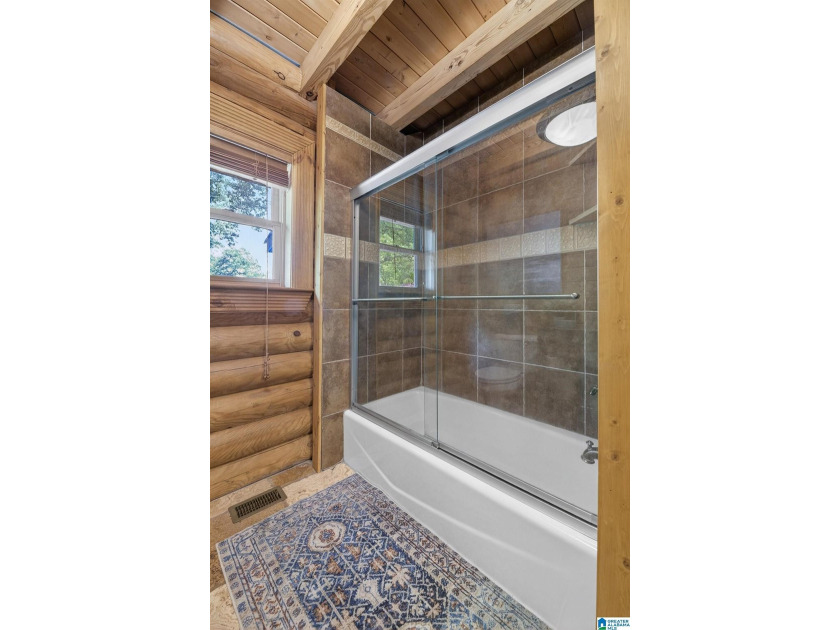 Experience refined lakefront living in this exceptional log - photo 41