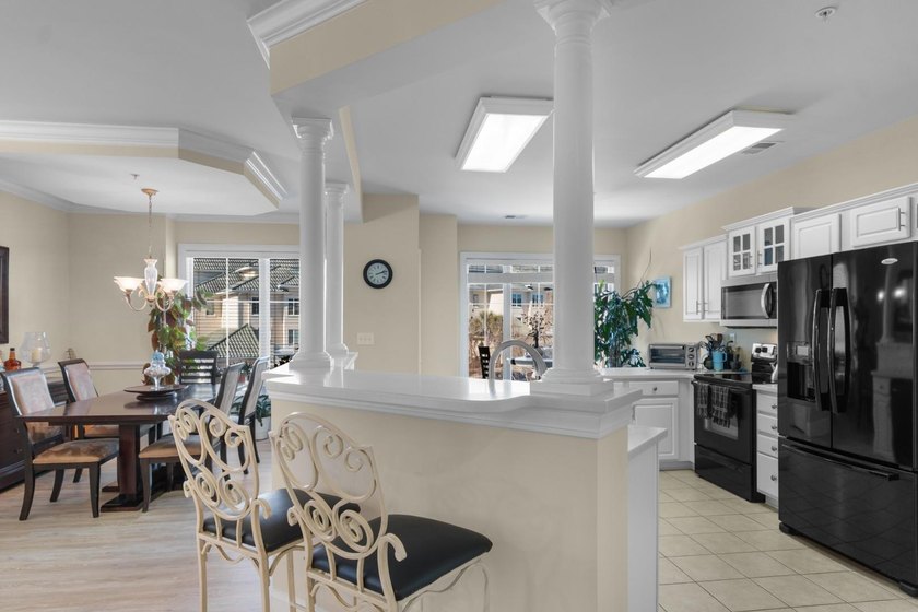 Sunlight pours into this bright, open 3-bedroom, 2-bath end-unit - photo 8