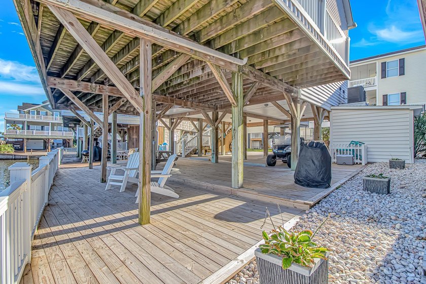 This LAKE FRONT 5 bedroom 3.5 bath raised beach house with - photo 2
