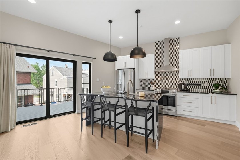 Welcome to 724 52nd Street, a striking free-standing modern - photo 13