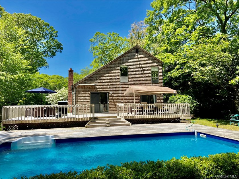 Tucked away saltbox home with an inground pool and abundant - photo 10