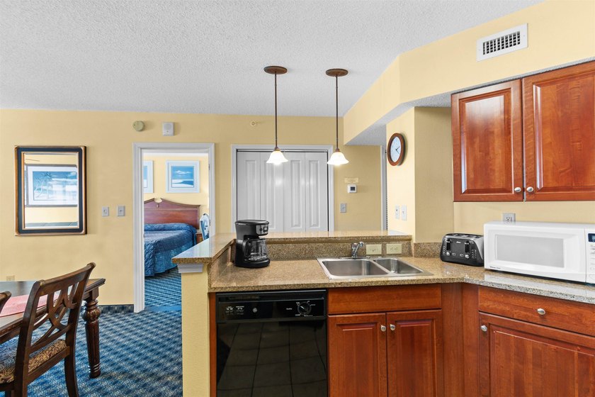 This beautifully furnished three bedroom Penthouse level unit at - photo 8