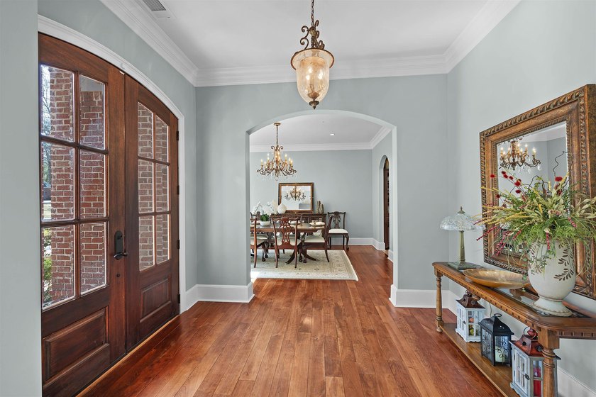 This elegant executive brick home offers luxury living and - photo 7
