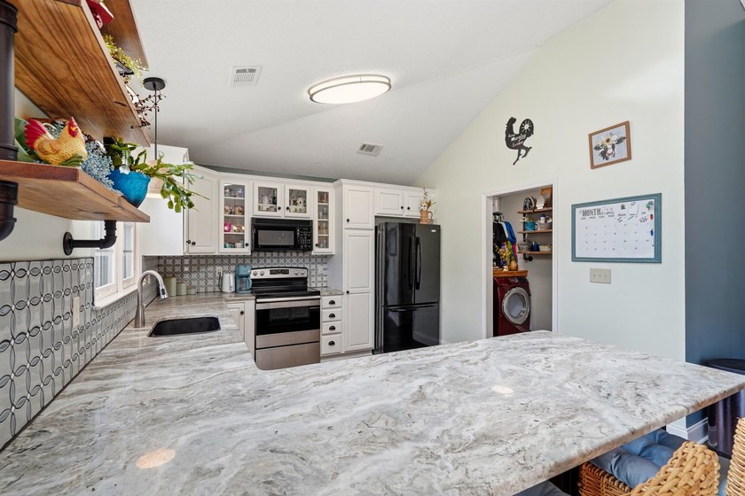 This beautifully updated 3-bedroom, 2-bath home offers both - photo 7