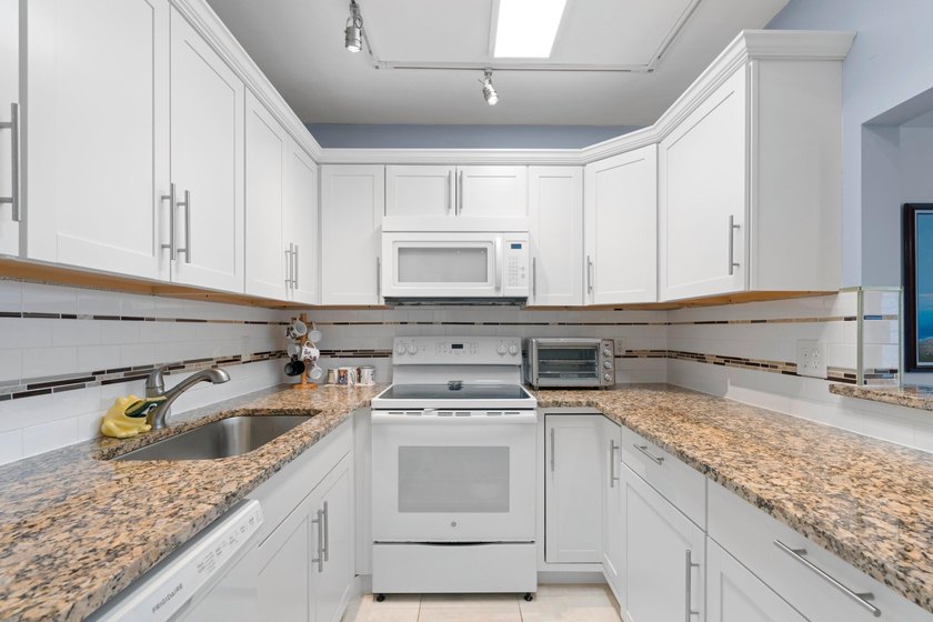 Remodeled one bedroom condo featuring garden view from the - photo 5