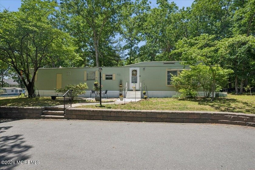 Welcome home! This stylish mobile home offers two bedrooms, a - photo 2