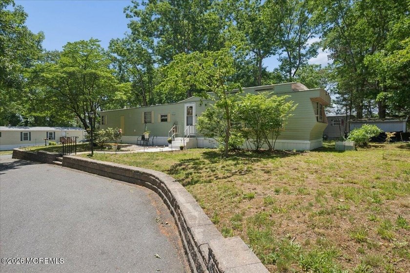 Welcome home! This stylish mobile home offers two bedrooms, a - photo 4