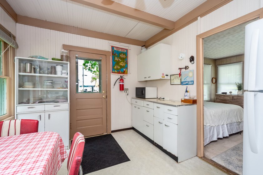 Cute as can be and full of charm! Welcome to this inviting lake - photo 15