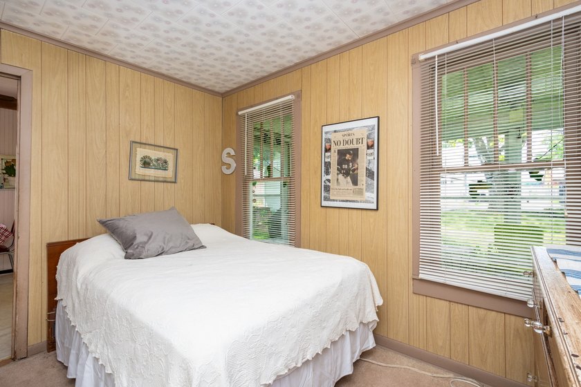 Cute as can be and full of charm! Welcome to this inviting lake - photo 17