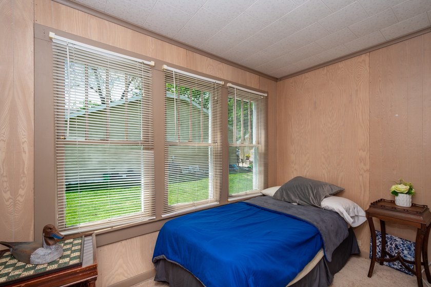 Cute as can be and full of charm! Welcome to this inviting lake - photo 18