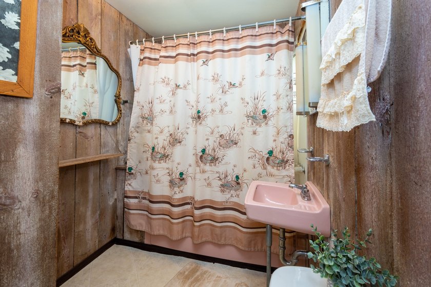 Cute as can be and full of charm! Welcome to this inviting lake - photo 19