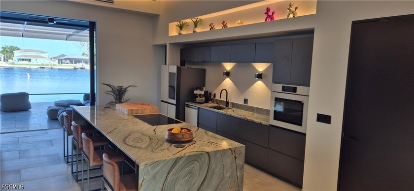 This elegant, all custom-designed home features direct Gulf - photo 6