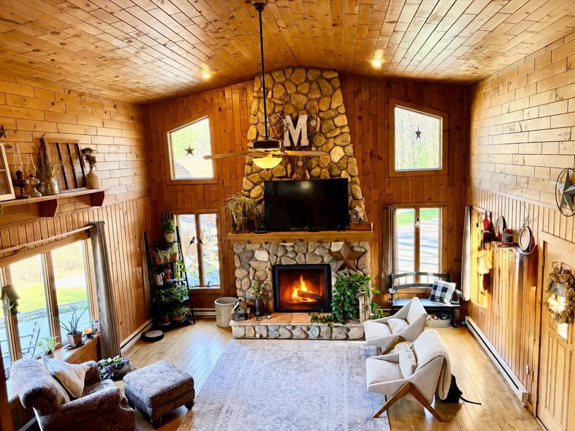 Set on a beautifully wooded 1.7-acre lot with 393 feet of sandy - photo 7
