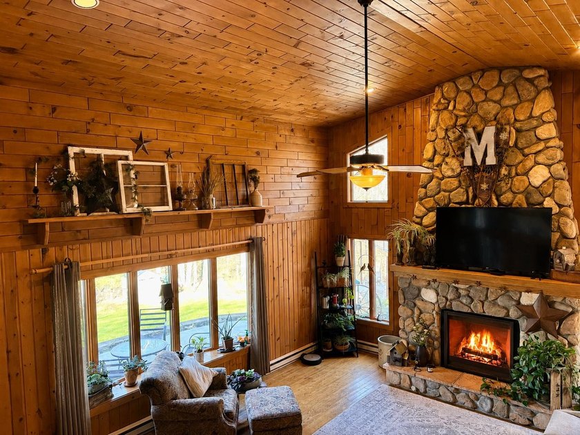 Set on a beautifully wooded 1.7-acre lot with 393 feet of sandy - photo 8