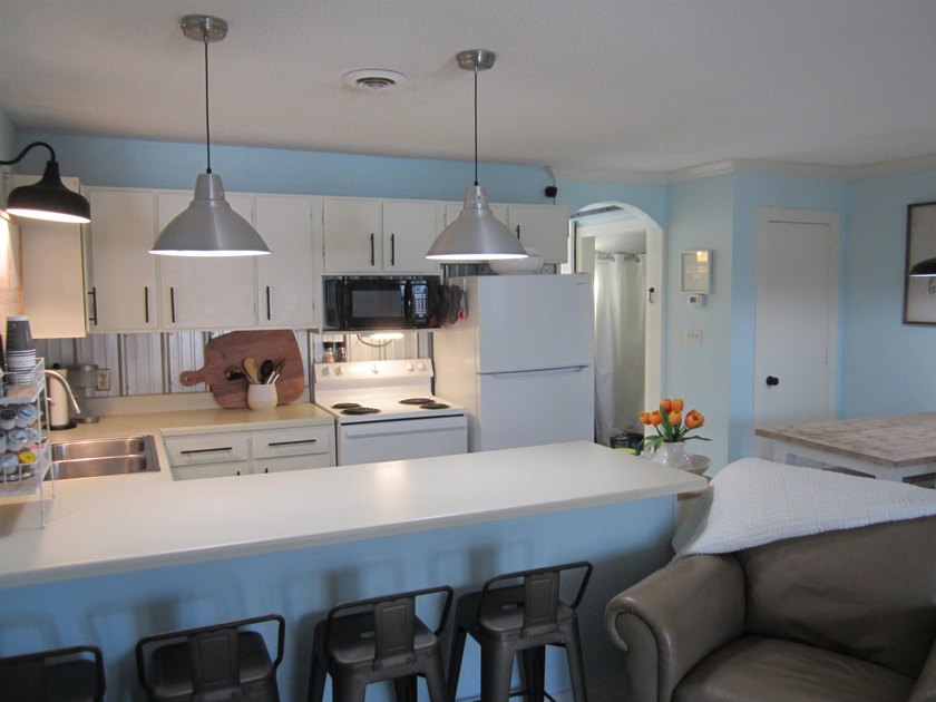 Step into your own coastal escape with this beautifully updated - photo 6