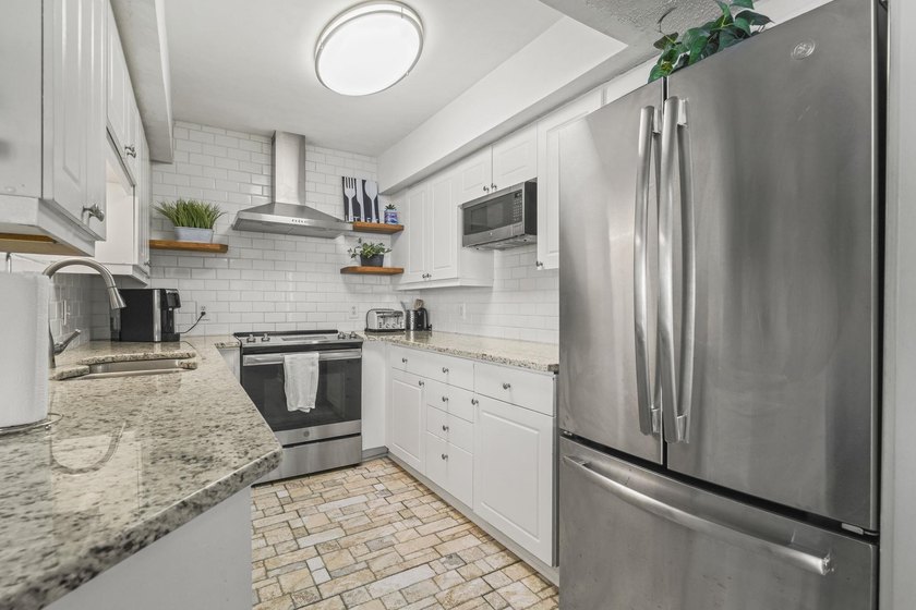 Welcome to The Ocean Bay Club Unit 1305, a beautifully upgraded - photo 5