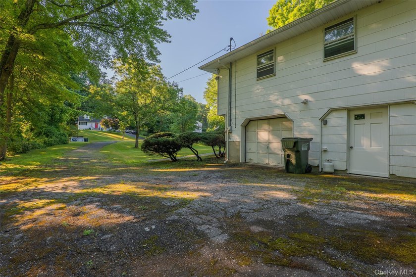 Welcome to 18 Sheryl Lane, a spacious raised ranch nestled on a - photo 5