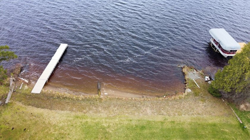 Experience exceptional lake living on Boom Lake, part of the - photo 3