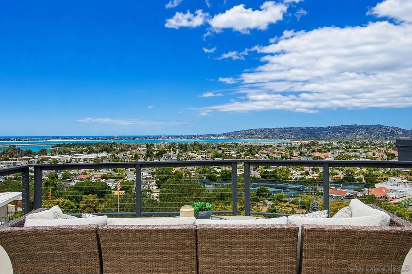 Commandingly perched in coveted Bay Park, this extraordinary - photo 4