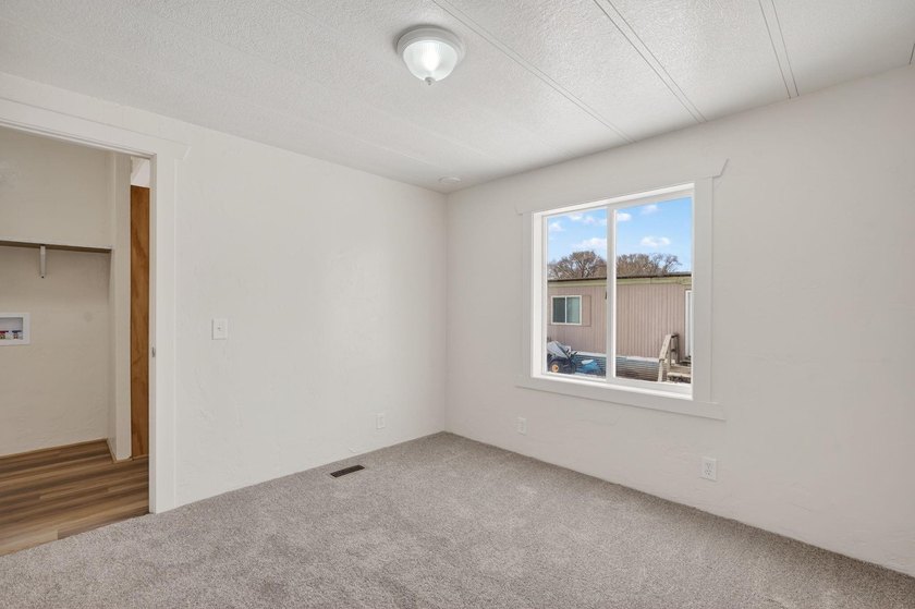 This recently remodeled 3 Bedroom, 2 Bath manufactured home is - photo 11