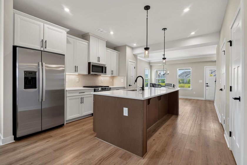 Discover the thoughtfully designed Bethany floor plan, offering - photo 7