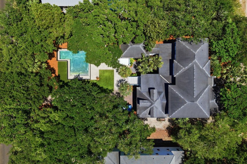Surrounded by mature live oaks and set on more than half an acre - photo 3