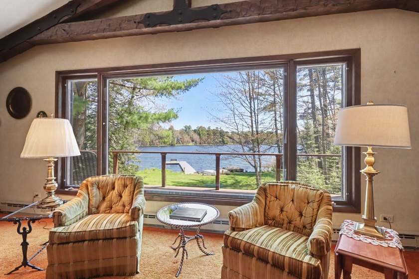 Nestled on nearly 4 private acres along the shores of 54 acre - photo 2