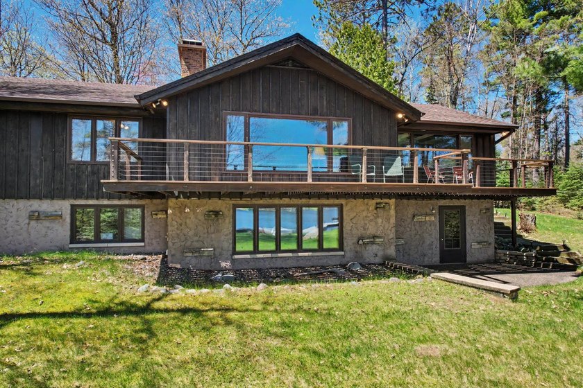 Nestled on nearly 4 private acres along the shores of 54 acre - photo 4