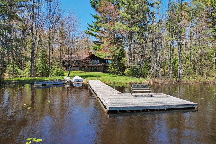 Nestled on nearly 4 private acres along the shores of 54 acre - photo 5