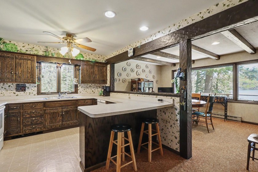 Nestled on nearly 4 private acres along the shores of 54 acre - photo 9