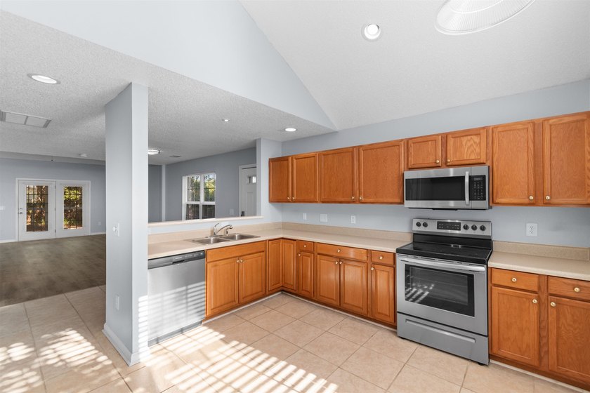 This spacious townhome features three bedrooms, two full baths - photo 9
