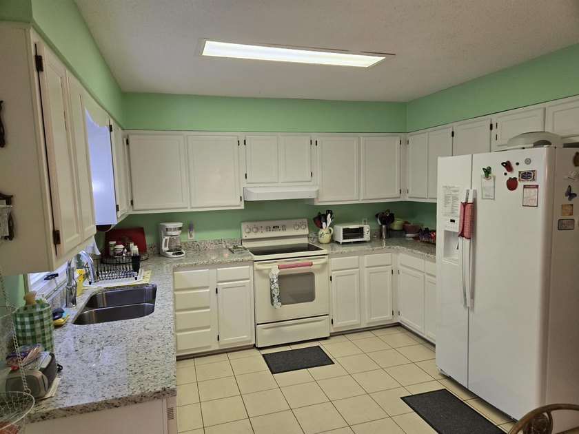 This is a wonderful home that sits on the marsh in Windjammer - photo 13