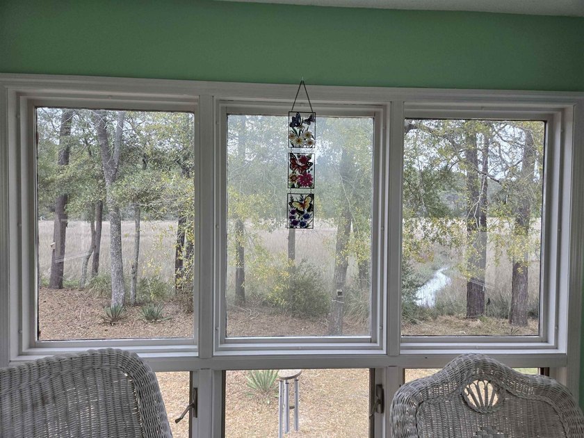 This is a wonderful home that sits on the marsh in Windjammer - photo 15