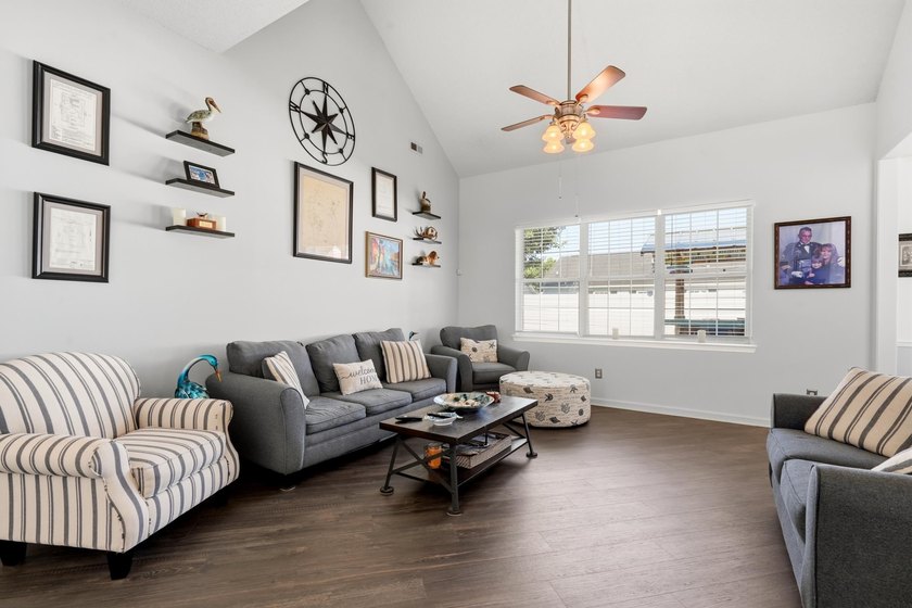 Welcome to this charming 3-bedroom, 2-bath home offering an - photo 4